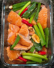 Load image into Gallery viewer, A dish with raw salmon, soy and vegetables
